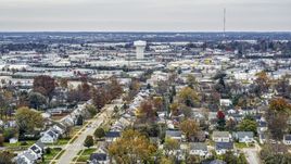 Homes with view of a water tower surrounded by warehouses in Lexington, Kentucky Aerial Stock Photos | DXP001_099_0017