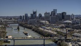 The city skyline seen from traffic on bridge over the river, Downtown Nashville, Tennessee Aerial Stock Photos | DXP002_113_0002