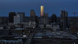 Light reflecting off skyscrapers in city's skyline, seen from Church Street at twilight in Downtown Nashville, Tennessee Aerial Stock Photos | DXP002_115_0002
