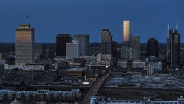 A view of light reflecting off skyscrapers in city's skyline, seen from near Church Street at twilight in Downtown Nashville, Tennessee Aerial Stock Photos | DXP002_115_0005
