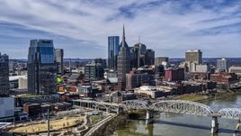 A view of the AT&T Building and a bridge over the river in Downtown Nashville, Tennessee Aerial Stock Photos | DXP002_116_0002