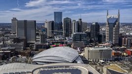 The city's skyline behind the arena, Downtown Nashville, Tennessee Aerial Stock Photos | DXP002_117_0009