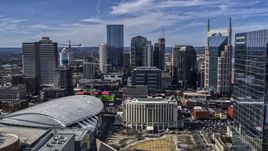 City's skyline behind the arena and hotel, Downtown Nashville, Tennessee Aerial Stock Photos | DXP002_117_0012