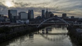 City skyline, bridges spanning the Cumberland River at sunset, Downtown Nashville, Tennessee Aerial Stock Photos | DXP002_119_0012