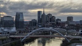 The downtown skyline seen from bridge on Cumberland River at sunset, Downtown Nashville, Tennessee Aerial Stock Photos | DXP002_120_0001