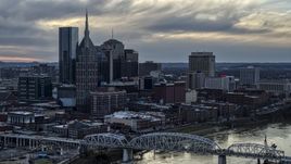 The riverfront skyline, and a bridge spanning the Cumberland River at sunset, Downtown Nashville, Tennessee Aerial Stock Photos | DXP002_120_0005