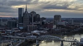 Riverfront skyline, pedestrian bridge, and Cumberland River at sunset, Downtown Nashville, Tennessee Aerial Stock Photos | DXP002_120_0006