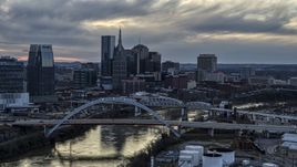 The riverfront skyline, two bridges, and the Cumberland River at sunset, Downtown Nashville, Tennessee Aerial Stock Photos | DXP002_120_0007