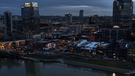 Riverfront buildings, cars on Broadway at twilight, Downtown Nashville, Tennessee Aerial Stock Photos | DXP002_120_0013