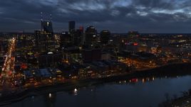 A view across the river toward the city's skyline at twilight, Downtown Nashville, Tennessee Aerial Stock Photos | DXP002_121_0004