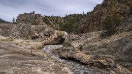 Rapids flowing through a rock formation in the mountains of New Mexico Aerial Stock Photos | DXP002_129_0001