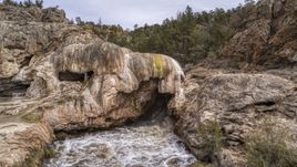 A close-up view of river rapids flowing through a rock formation in the mountains in New Mexico Aerial Stock Photos | DXP002_129_0003