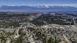 Distant mountains seen from neighborhoods near mesas and canyons in Los Alamos, New Mexico Aerial Stock Photos | DXP002_134_0002