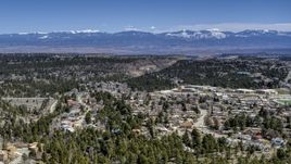 A view of distant mountains seen from homes near mesas and canyons in Los Alamos, New Mexico Aerial Stock Photos | DXP002_134_0003