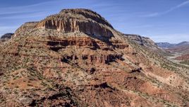 The side of a tall butte with steep slopes, New Mexico Aerial Stock Photos | DXP002_135_0005
