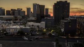 A view of tall office high-rises at sunset in Downtown Phoenix, Arizona Aerial Stock Photos | DXP002_139_0002