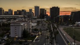 A view of tall office high-rises at sunset in Downtown Phoenix, Arizona Aerial Stock Photos | DXP002_139_0003