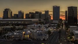 The city's office high-rises at sunset in Downtown Phoenix, Arizona Aerial Stock Photos | DXP002_139_0006