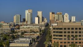 The city's skyline seen from state government offices at sunset in Downtown Phoenix, Arizona Aerial Stock Photos | DXP002_143_0003