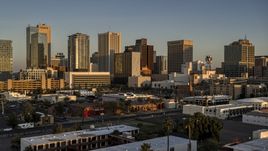 A view of the tall office buildings in the city's skyline at sunset, Downtown Phoenix, Arizona Aerial Stock Photos | DXP002_143_0006