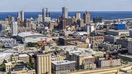 The city's skyline and arena in Downtown Milwaukee, Wisconsin, seen from industrial buildings Aerial Stock Photos | DXP002_152_0003