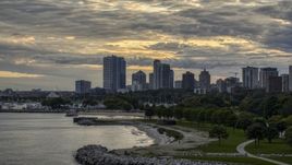A beach and the city's skyline at twilight, Downtown Milwaukee, Wisconsin Aerial Stock Photos | DXP002_155_0002