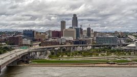 The city skyline and park across the river, Downtown Omaha, Nebraska Aerial Stock Photos | DXP002_168_0003
