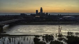 The skyline seen from the river at twilight, Downtown Omaha, Nebraska Aerial Stock Photos | DXP002_172_0014