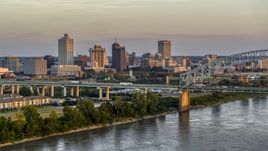 The city's skyline behind the bridge at sunset, Downtown Memphis, Tennessee Aerial Stock Photos | DXP002_181_0002