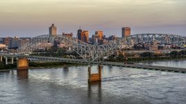 The city's skyline as traffic crosses the bridge at sunset, Downtown Memphis, Tennessee Aerial Stock Photos | DXP002_181_0003