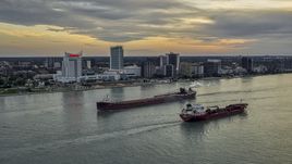 Oil tankers passing on the Detroit River near skyline of Windsor, Ontario, Canada, sunset Aerial Stock Photos | DXP002_192_0010
