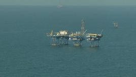 HD aerial stock footage of a large oil platform in the Gulf of Mexico Aerial Stock Footage | AF0001_000167