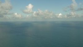 HD aerial stock footage of passing the open water of the Gulf of Mexico with clouds overhead Aerial Stock Footage | AF0001_000190