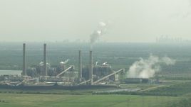 HD aerial stock footage zoom to a wider view of WA Parish Generating Station on Smithers Lake, Texas Aerial Stock Footage | AF0001_000239