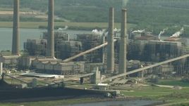 HD aerial stock footage flyby smoke stacks and plant structures at WA Parish Generating Station by Smithers Lake, Texas Aerial Stock Footage | AF0001_000241