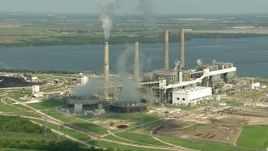 HD aerial stock footage zoom to a wider view of WA Parish Generating Station and smoke stacks at Smithers Lake, Texas Aerial Stock Footage | AF0001_000243