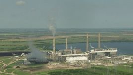 HD aerial stock footage of a reverse view of the lakeside power plant by Smithers Lake, Texas Aerial Stock Footage | AF0001_000244