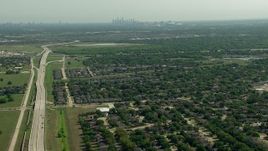 HD aerial stock footage of flying over the Fort Bend Parkway and suburban neighborhoods in Houston, Texas Aerial Stock Footage | AF0001_000248