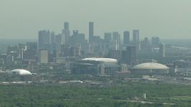 HD aerial stock footage of NRG Stadium, Houston Astrodome, and the city skyline of Downtown Houston, Texas Aerial Stock Footage | AF0001_000252