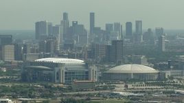 HD aerial stock footage of approaching NRG Stadium, Houston Astrodome, and Downtown Houston, Texas Aerial Stock Footage | AF0001_000254
