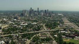 HD aerial stock footage of approaching the city skyline from the freeway interchange, Downtown Houston, Texas Aerial Stock Footage | AF0001_000259