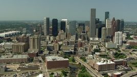 HD aerial stock footage orbit Harris County Jail Facility, Bakers Street Jail and city skyscrapers in Downtown Houston, Texas Aerial Stock Footage | AF0001_000263