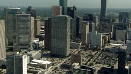 HD aerial stock footage flyby city skyscrapers to reveal Toyota Center arena and the convention center, Downtown Houston, Texas Aerial Stock Footage | AF0001_000266