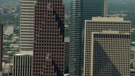 HD aerial stock footage tilt from Bank of America Center to reveal a parking garage in Downtown Houston, Texas Aerial Stock Footage | AF0001_000270