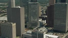 HD aerial stock footage of flying around Downtown Houston buildings and skyscrapers, Texas Aerial Stock Footage | AF0001_000272