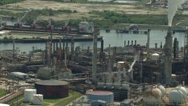 HD aerial stock footage pan across a riverfront oil refinery in Harrisburg, Manchester, Texas Aerial Stock Footage | AF0001_000280