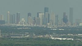 HD aerial stock footage of a view of the distant skyline of Downtown Houston, Texas Aerial Stock Footage | AF0001_000298