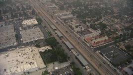 HD aerial stock footage of reverse view of warehouse buildings on San Fernando Road, Sylmar, California Aerial Stock Footage | AF0001_000353