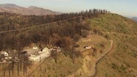 HD aerial stock footage of abandoned buildings and power lines on a ridge in the San Gabriel Mountains, California Aerial Stock Footage | AF0001_000471