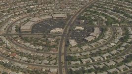 HD aerial stock footage of La Ronde Shopping Center circled by homes in Sun City, Arizona Aerial Stock Footage | AF0001_000834